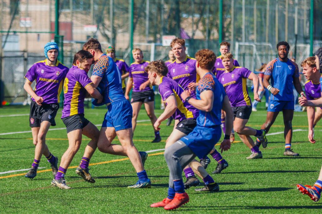 Manchester Met and University of Manchester rugby league teams in action